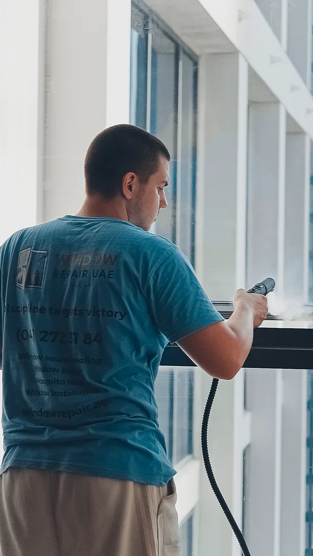 Technician cleaning a window profile before sealing