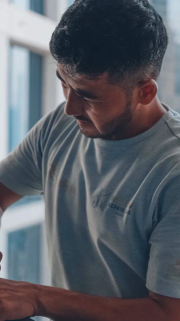 Technician working the frame of floor-to-ceiling glazing