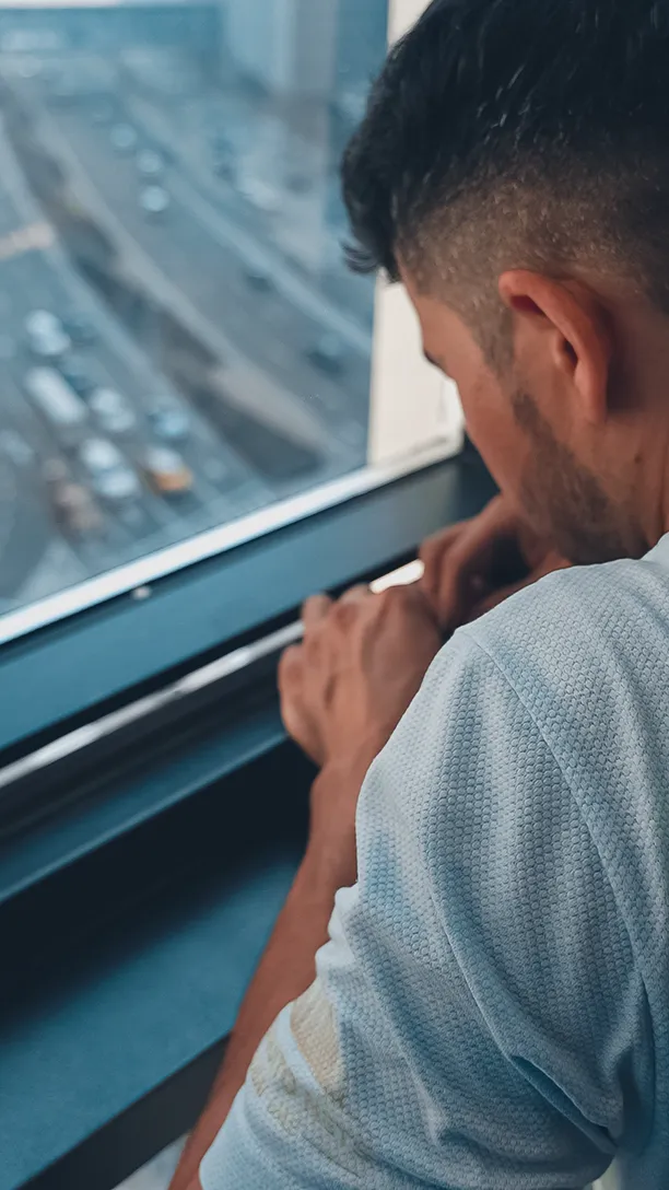 Close work on a window frame on a high floor in Dubai