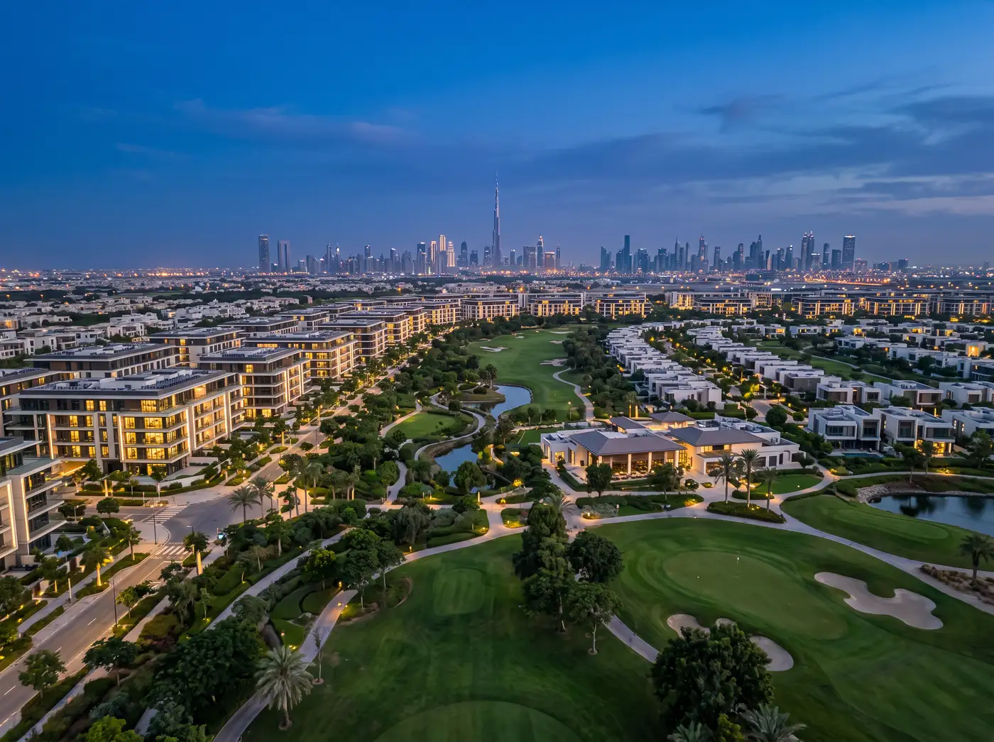 Dubai Hills Estate at blue hour: modern villas around the park and golf course, Burj Khalifa on the horizon