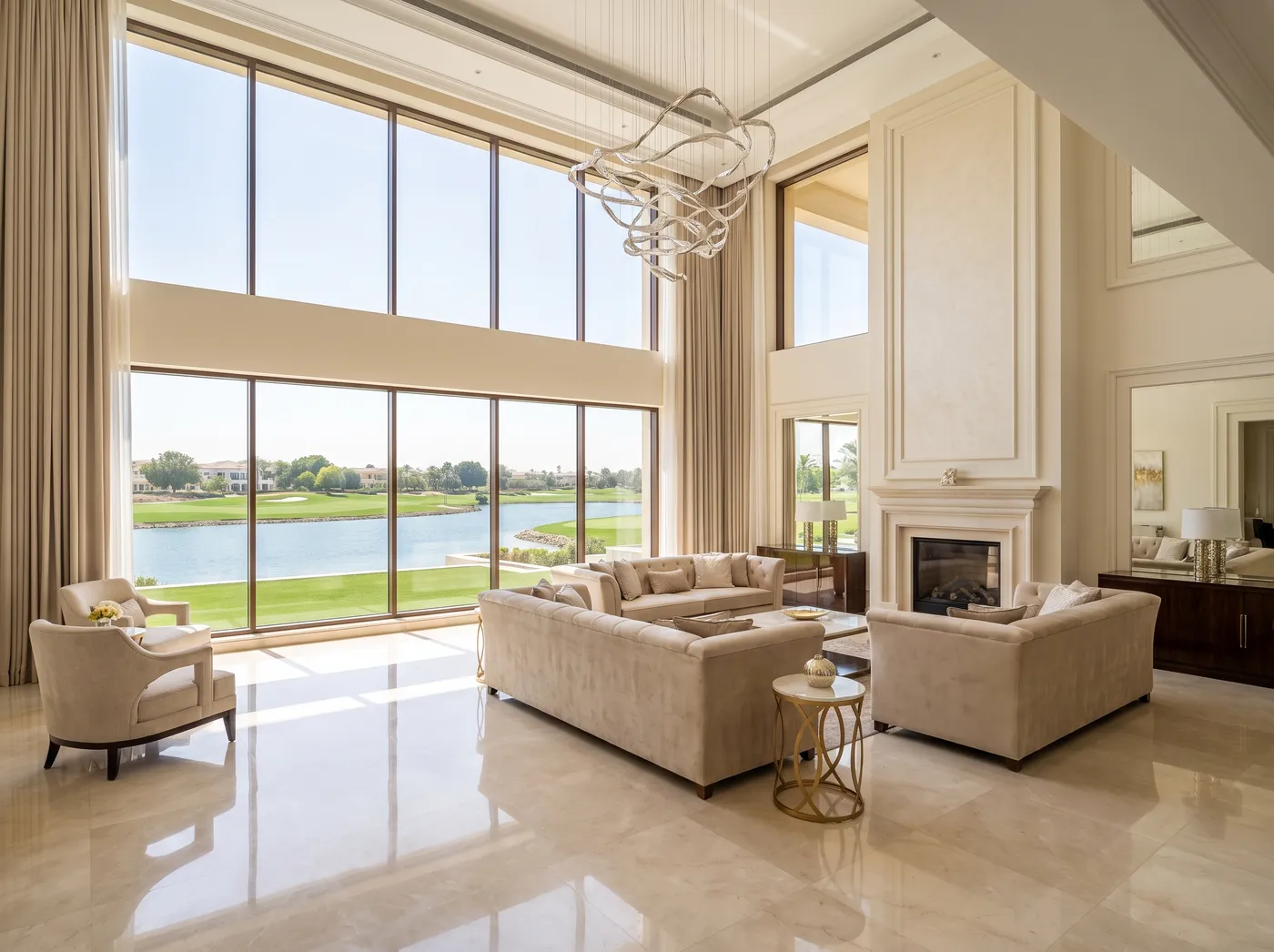 Emirates Hills mansion interior with double-height glazing over the golf course