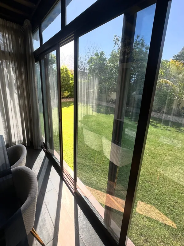 Panoramic sliding doors opening onto a Dubai terrace after repair