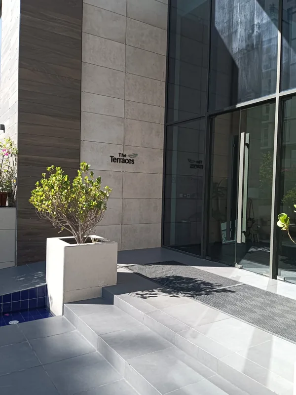 Balcony sliding door onto a Dubai city view after service