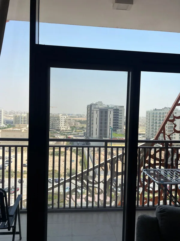 Balcony sliding door onto a Dubai city view after service
