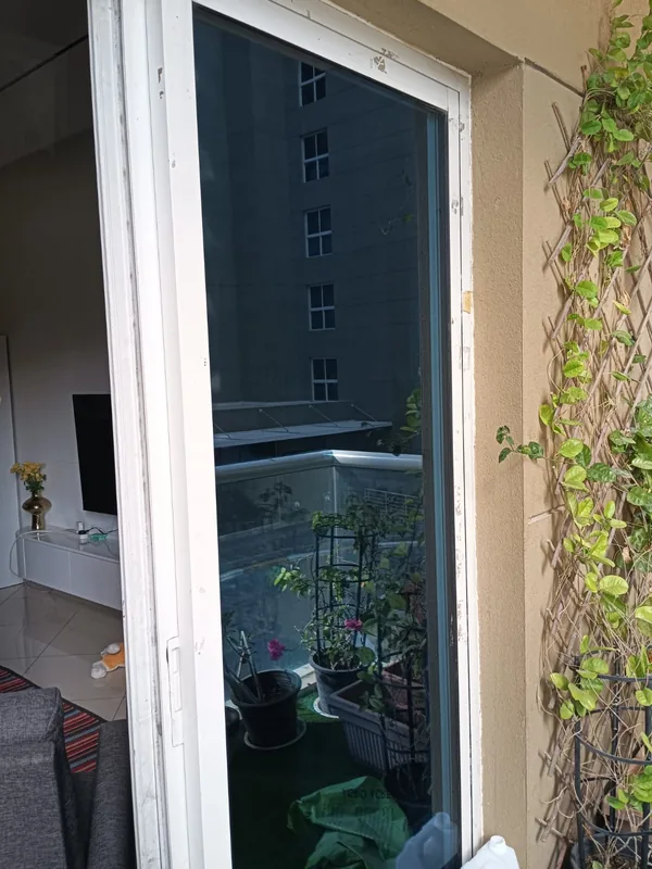 Panoramic sliding doors opening onto a Dubai terrace after repair