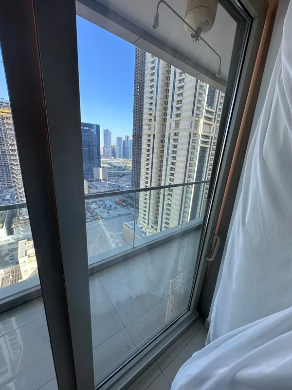 Balcony sliding door onto a Dubai city view after service