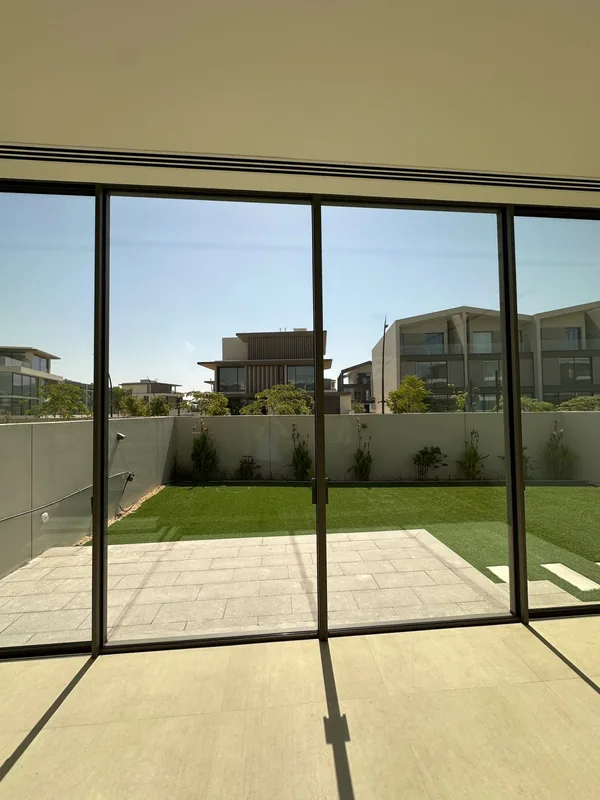 Panoramic sliding doors opening onto a Dubai terrace after repair
