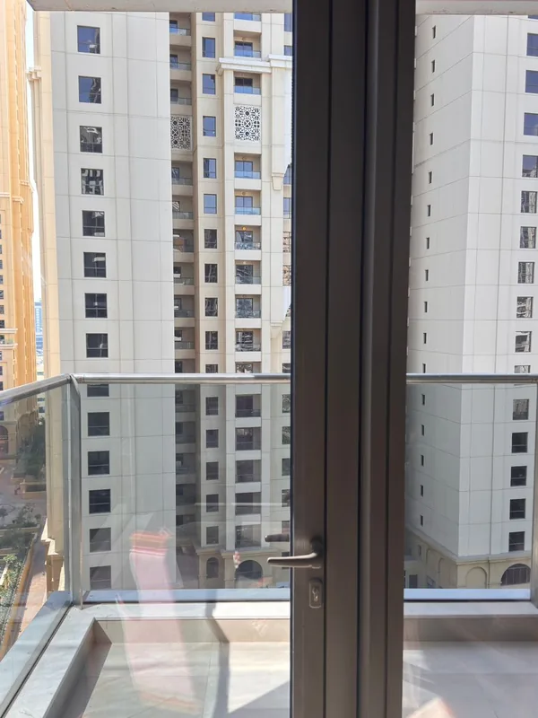 Panoramic sliding doors opening onto a Dubai terrace after repair