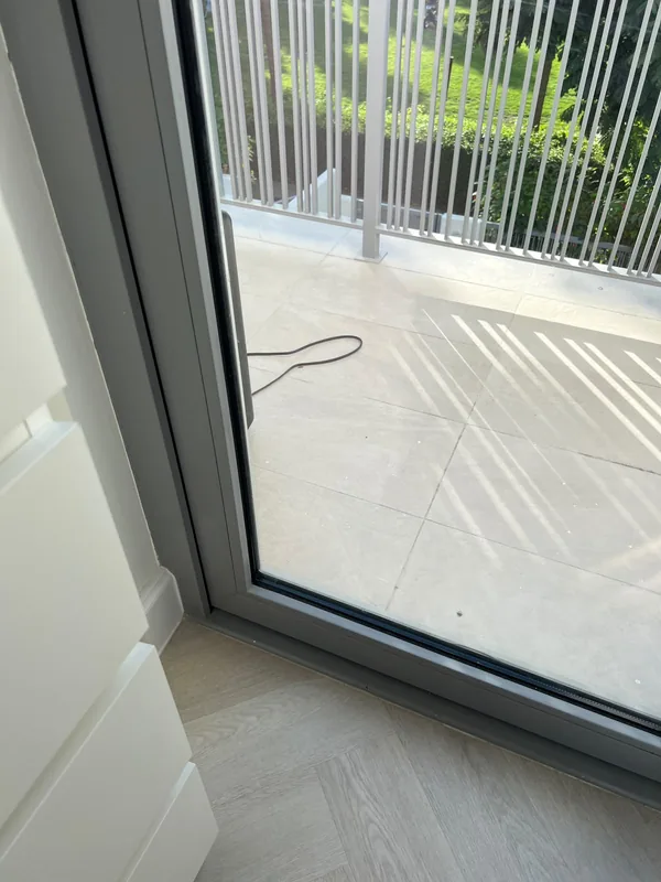 Sliding door with replaced rollers in a Dubai home