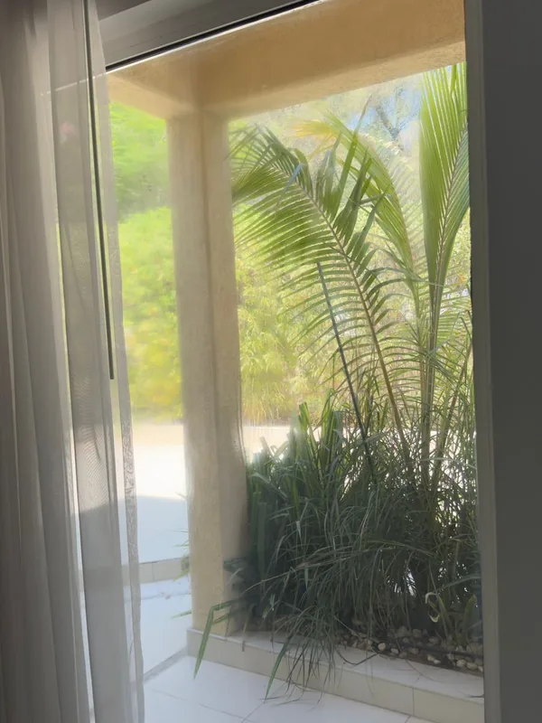 Balcony sliding door onto a Dubai city view after service