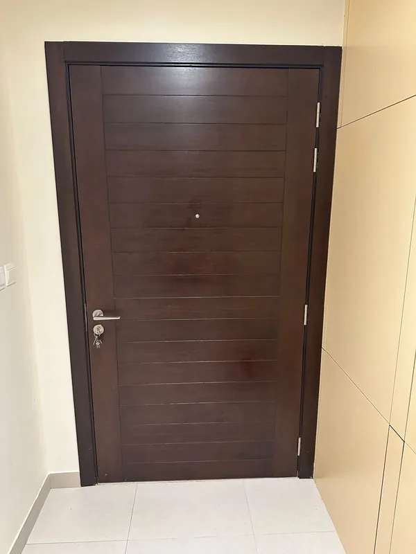 Panoramic sliding doors opening onto a Dubai terrace after repair
