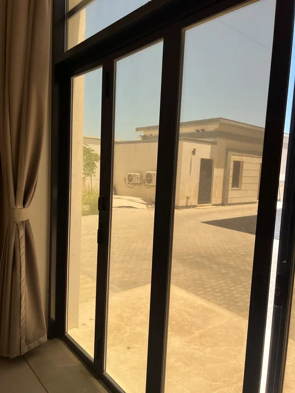 Sliding door with replaced rollers in a Dubai home
