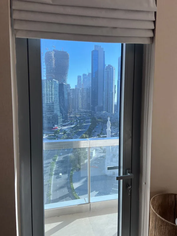 Balcony sliding door onto a Dubai city view after service
