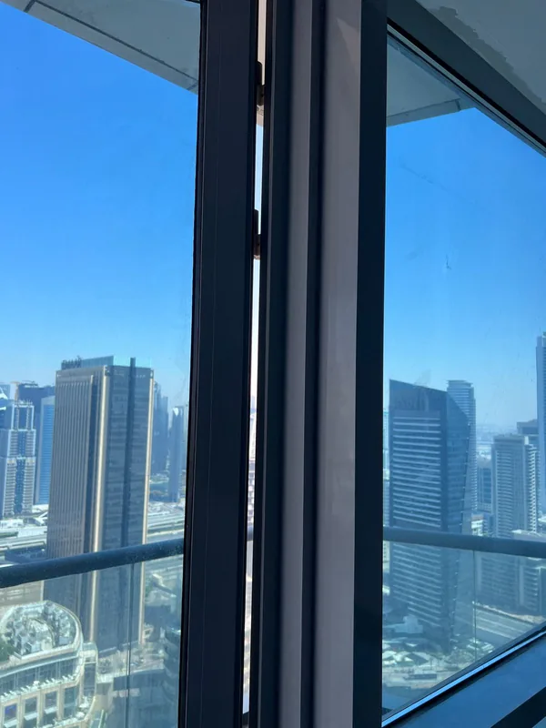 Panoramic sliding doors opening onto a Dubai terrace after repair