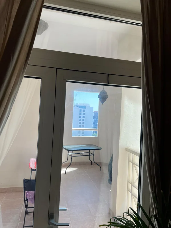 Sliding door with replaced rollers in a Dubai home