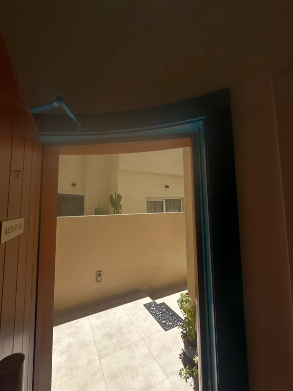 Balcony sliding door onto a Dubai city view after service
