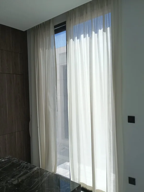 Balcony sliding door onto a Dubai city view after service