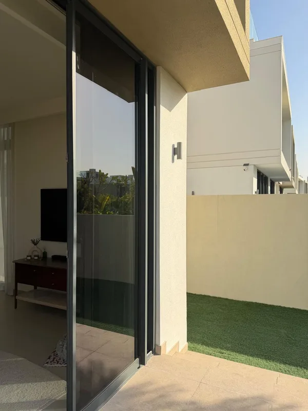 Sliding patio door onto a villa courtyard in Dubai running smoothly after adjustment