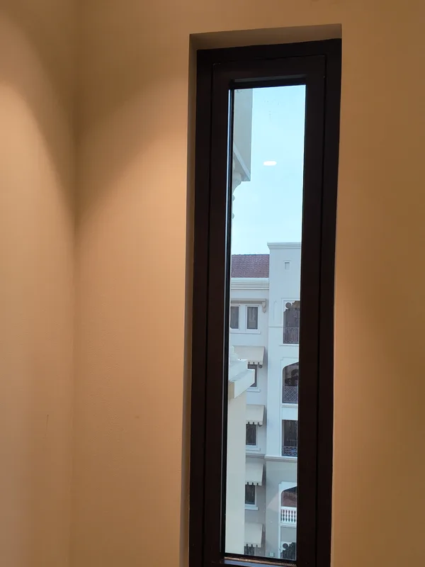 Tall casement window refitted and sealed in a Dubai residence