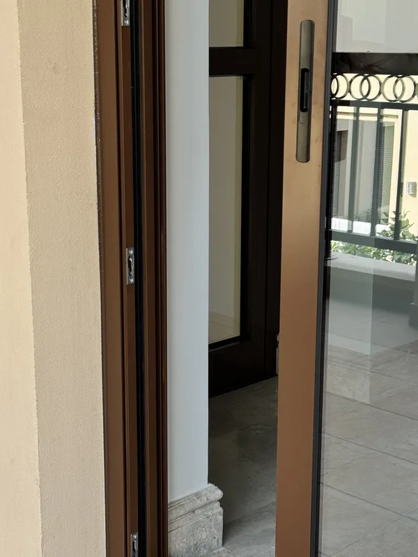 Repaired window overlooking a private patio in a Dubai villa