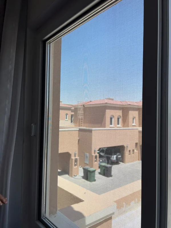Adjusted casement window overlooking Dubai Marina towers