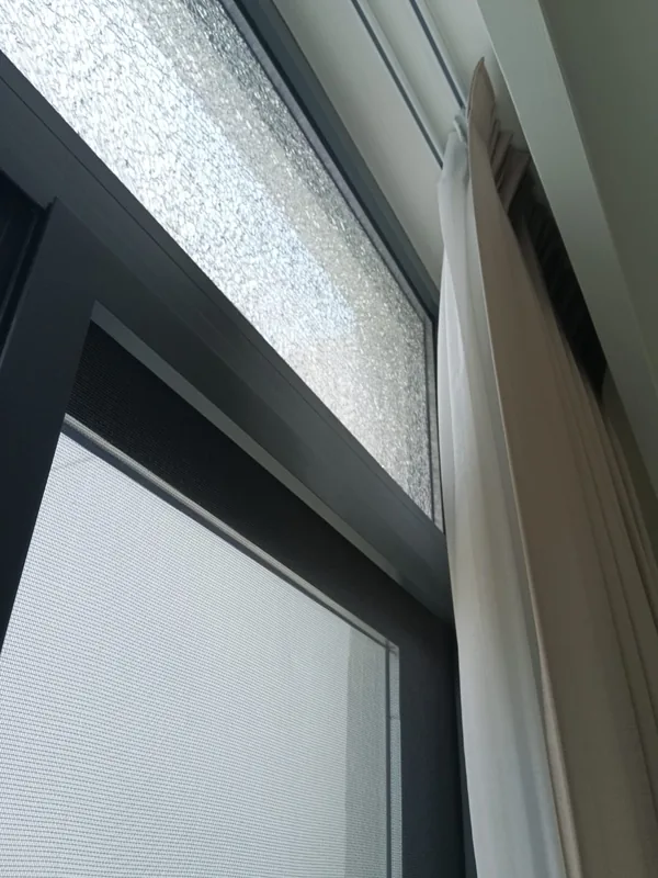 Adjusted casement window overlooking Dubai Marina towers