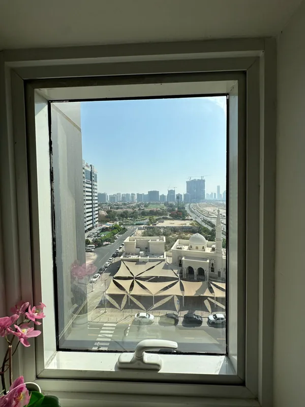 Adjusted casement window overlooking Dubai Marina towers