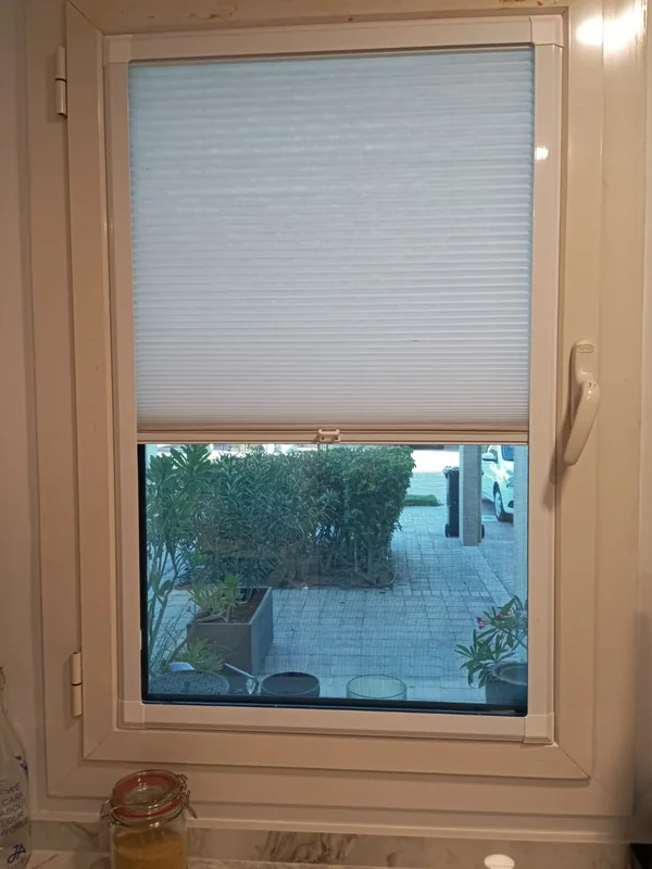Repaired window opening onto a Dubai villa garden