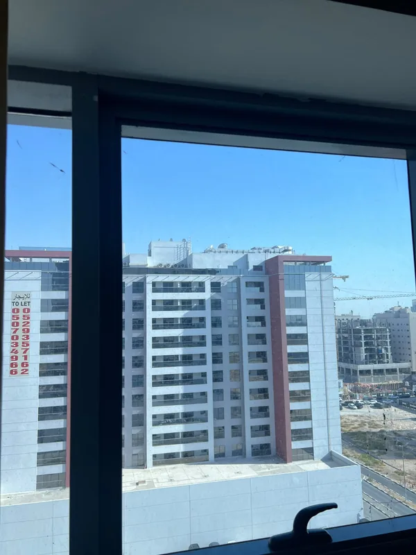 Adjusted casement window overlooking Dubai Marina towers