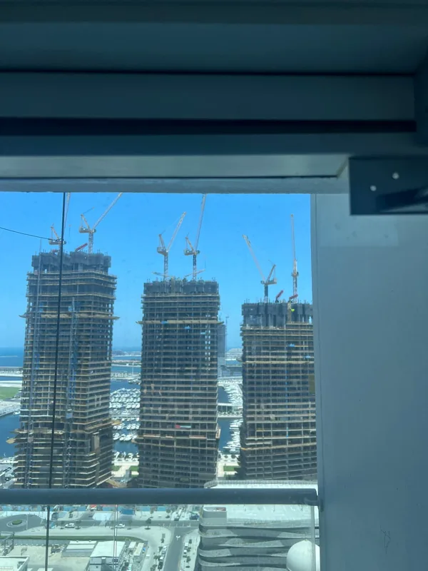 Adjusted casement window overlooking Dubai Marina towers