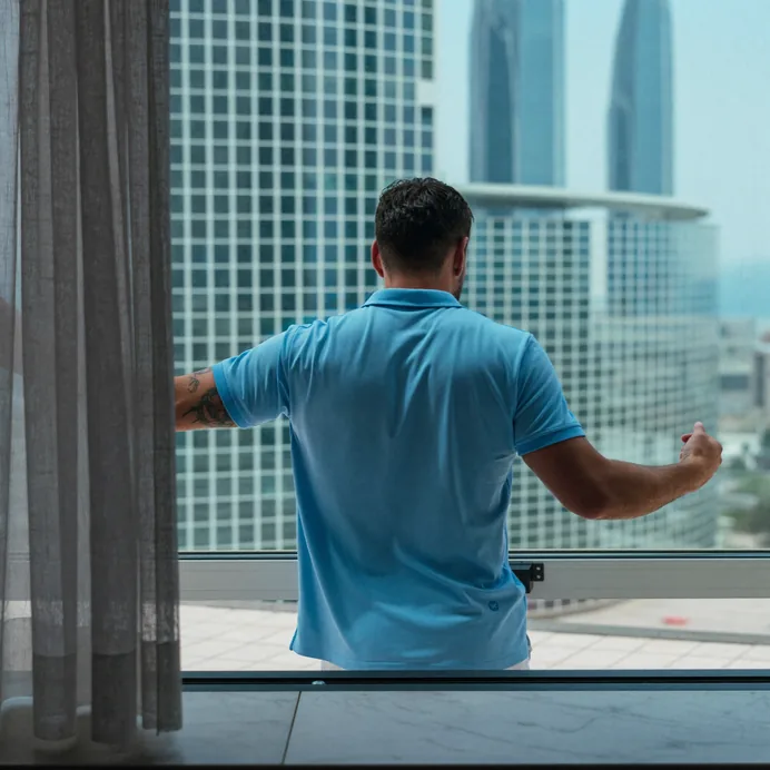 Technician repairing the lift mechanism of a tilt and slide patio door in Dubai